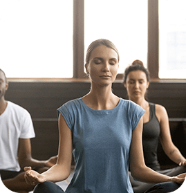 group-young-sporty-people-sitting-sukhasana-exercise-min